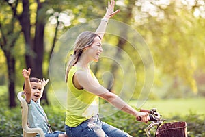 Family cycling outdoors Ã¢â¬â mother and son on bicycles in park